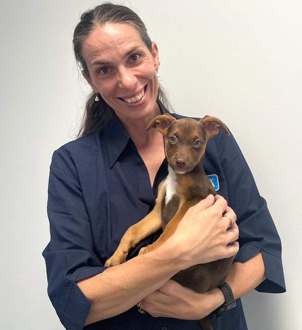 Christy Kalksma, SPCA National Education Officer, holding a puppy